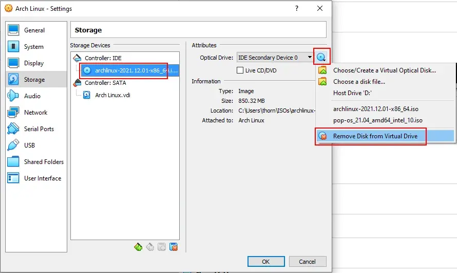The virtual machine settings dialog in VirtualBox. Red annotation rectangles
surround the archlinux-2021.12.01… device under Controller: IDE, the icon of a
disc next to Optical Drive, and “Remove Disk from Virtual Drive” in the menu
below the disc.