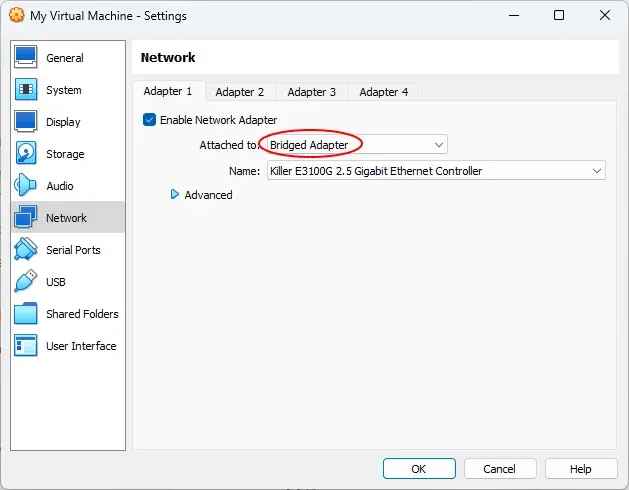 The Network settings in VirtualBox. A red annotation circle surrounds the
dropdown menu for “Attached to” where “Bridged Adapter” is currently
selected.
