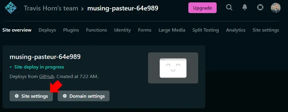 The Netlify project dashboard. A red annotation arrow points to the “Site
settings” button.