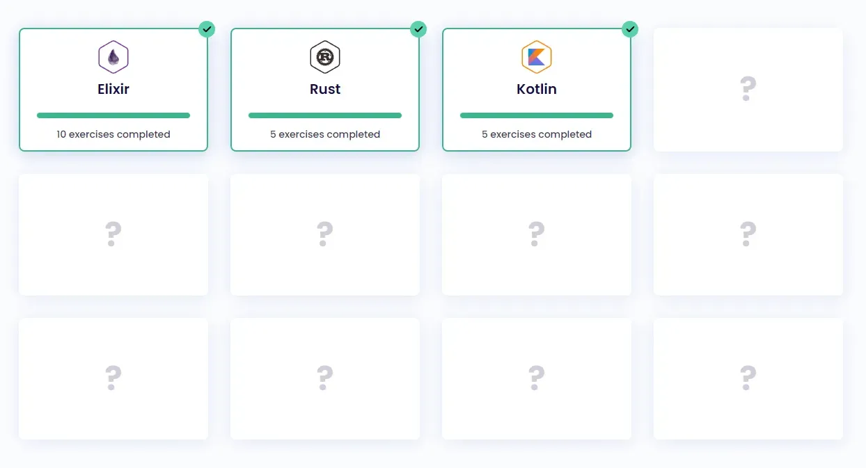 Exercism's #12in23 dashboard. Twelve grid squares are visible. Three are
filled in with Elixir, Rust, and Kotlin. The remaining nine are
empty.